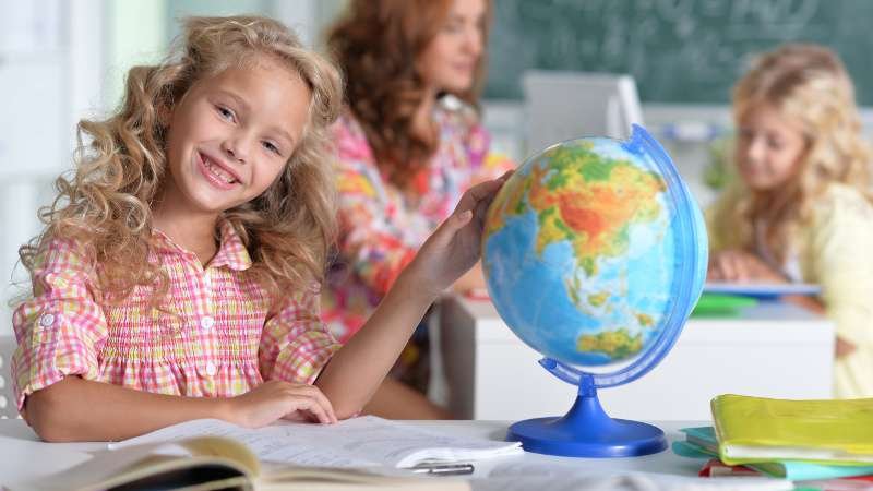 Portrait of teacher with two girls at lesson