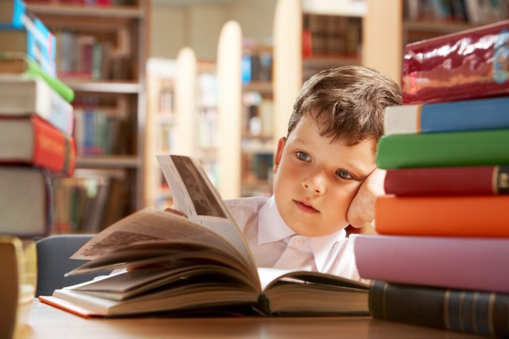 little-boy-studying-library-scaled.jpg